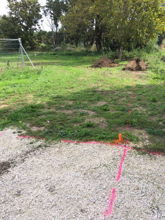 Traage par le gomtre de l'emplacement des murs d'entre du lotissement