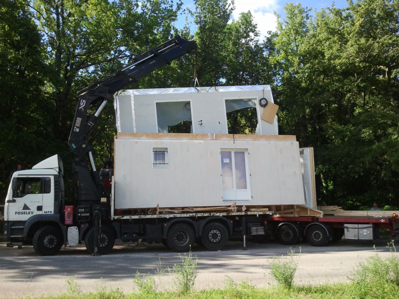 Transfert sur camion plus petit pour accs au terrain