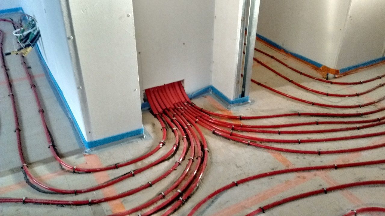 pose de l'isolant et du plancher chauffant fini.