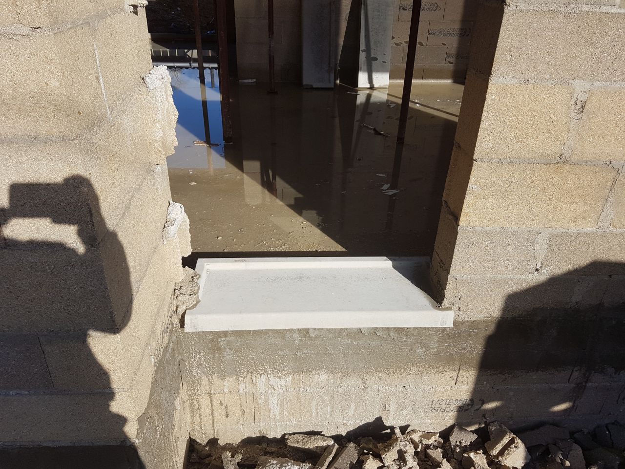 pose du seuil de la porte d'entrée