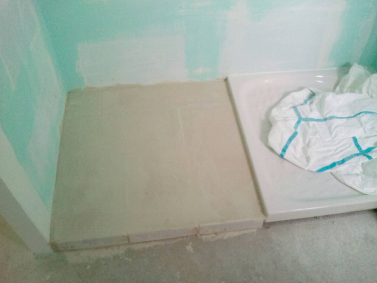 Réhausse sortie de douche