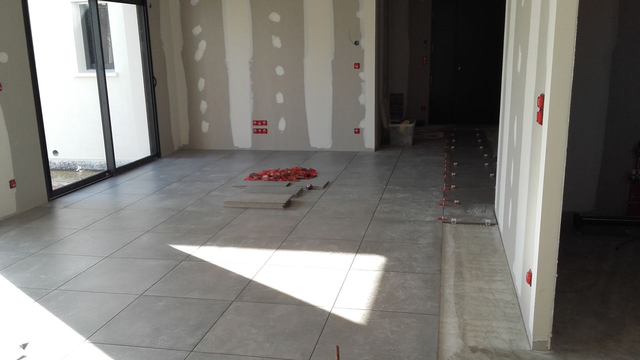 Pose carrelage pièce de vie