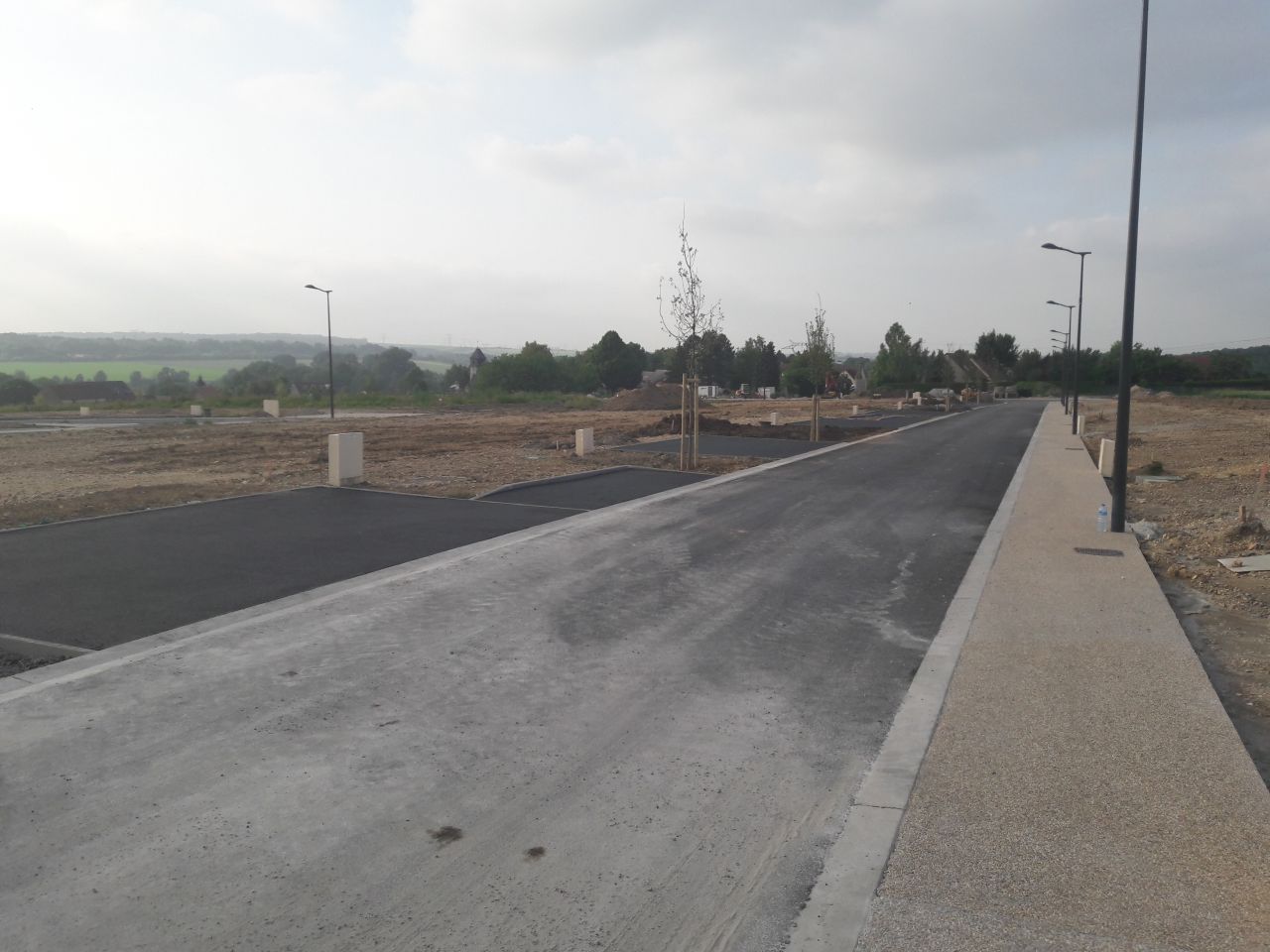 Réalisation des enrobés devant les accès de parcelles