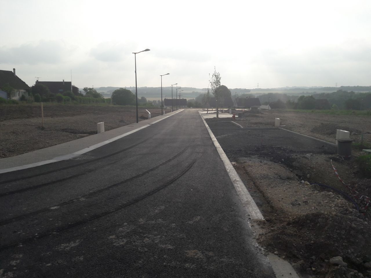 Réalisation des enrobés devant les accès de parcelles