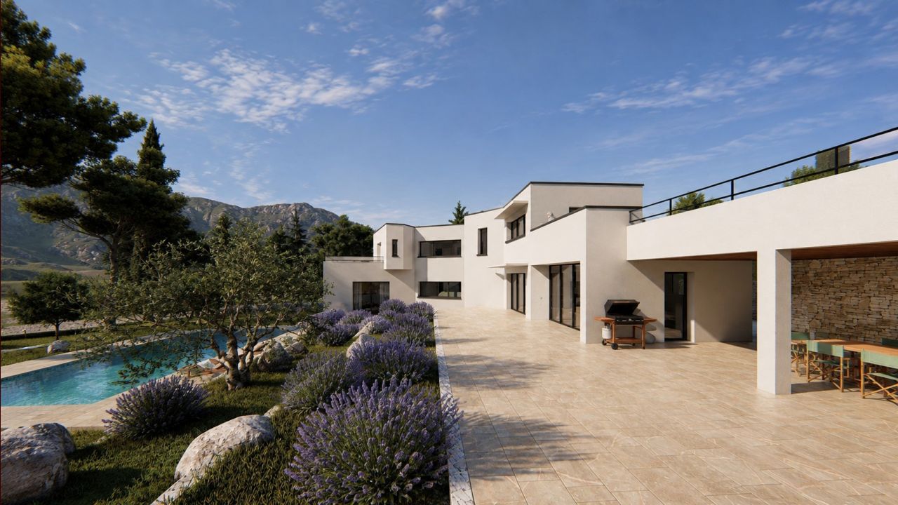 Terrasse d?une maison contemporaine à Nîmes bordée de lavandes, oliviers et murs en pierre