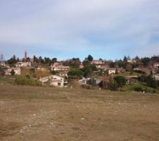 Vue de notre terrain: 1er lottissement et bourg de Montbrun-Lauragais, église.