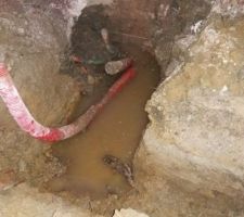 Vidage du vide sanitaire et raccordement du drain et des gouttiere au reseau communal