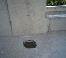 Percement de la dalle pour le conduit de fummée