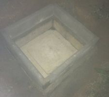 Aménagement de la trappe du puit de perte des eaux de pluies.