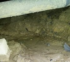 Coulée de boue sous longrines