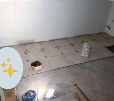 Pose du carrelage en cours au sous-sol