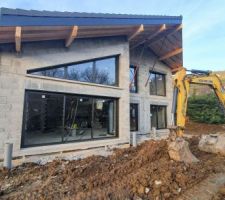 Mise en place des pieux bétons sous les poteaux bois