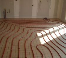 Mise en place plancher chauffant .