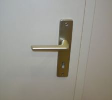 Poignée de porte simple coloris champagne pour portes intérieurs