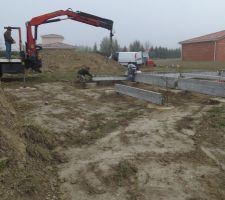 Pose des longrines pour terrasse