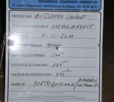 Depose du panneau de debut de construction