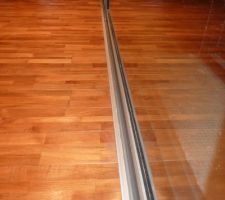 Baguette de finition entre parquet et baie vitrée