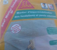 Protection des murs en agglos en contact avec le sable.