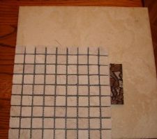 Ensemble mosa&iuml;que pour la douche italienne plus listel assortie &agrave; la colonne de douche plus sol pour toute la maison.