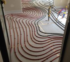 Pose de l'isolation en dalle de 70 mm   plancher chauffant